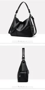Detailed views of a large black leather Boston bag with pebble texture and adjustable strap