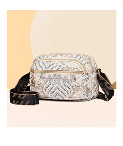 Detail of vintage jacquard pattern and double zipper design on ethnic crossbody bag