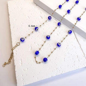 Collier en acier inoxydable plaqué or 18 carats avec perles œil grec bleues de 0,6 cm