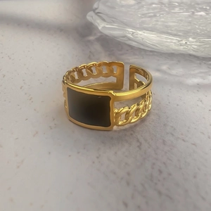 Gold-plated stainless steel chain ring with a minimalist black enamel square centerpiece