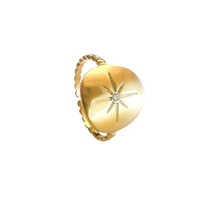 Gold eight-pointed star ring with center zircon and beaded band on white background
