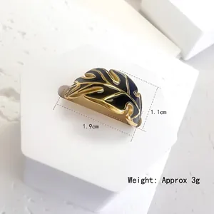 Golden palm leaf ring with black enamel finish, adjustable open band, 1.9cm x 1.1cm size