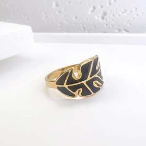 Golden stainless steel monstera leaf ring with black enamel details for women