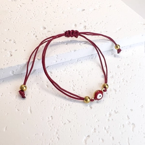 Adjustable dark red braided Evil Eye bracelet with gold beads and enamel charm