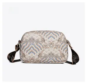 Detailed back view of vintage jacquard crossbody bag with traditional wave pattern