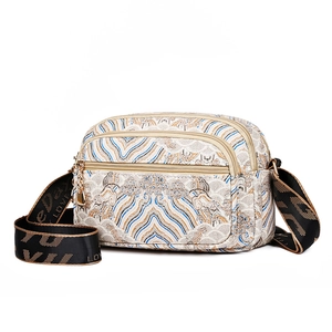 Vintage floral crossbody bag with blue mountain patterns and embroidered strap