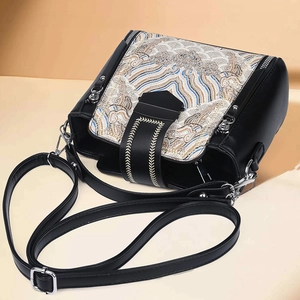 Elegant black crossbody bag with traditional Chinese wave embroidery and adjustable strap
