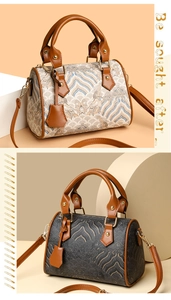 Detail of vintage textured Boston bag in beige and grey weave with brown leather handles
