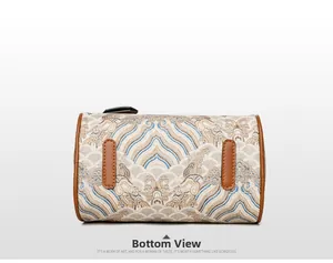 Detailed bottom view of large tote bag showing jacquard pattern and leather base patches