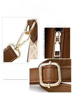 Close-up of light gold hardware hooks and zippers on a brown leather crossbody bag