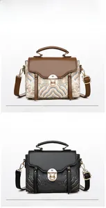 Detail of vintage tote bags with traditional cloud patterns and gold metal buckles