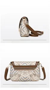 Detail view showing ethnic jacquard pattern and back zipper pocket of the crossbody bag
