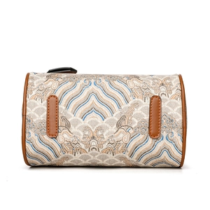 Retro barrel shoulder bag with traditional wave embroidery and brown leather trim