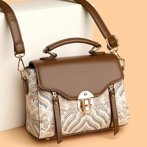 Vintage women's shoulder bag with brown leather flap and traditional cloud pattern fabric