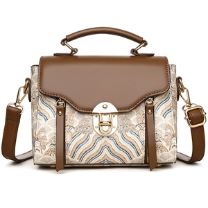 Vintage style women's crossbody bag with brown leather flap and woven textured body
