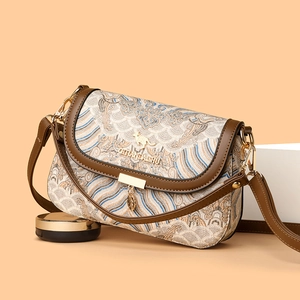 Ethnic style jacquard shoulder bag with brown leather strap and golden kangaroo logo
