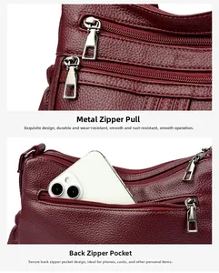 Détail du sac en cuir souple avec poche à fermeture argentée et texture grainée