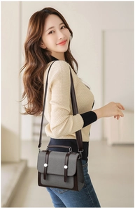 Borsa a tracolla chic in tessuto strutturato con finiture in pelle marrone e rivetti