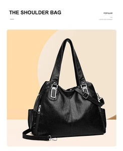 Vista laterale borsa tote in pelle PU nera con tasca con zip argento e tracolla lunga
