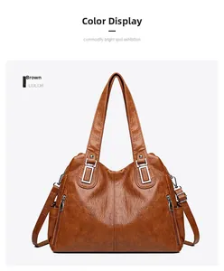 Dettagli della borsa tote marrone in pelle litchi con cerniere argentate e tracolla