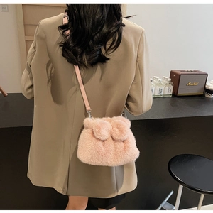 Pink plush crossbody bucket bag with rabbit ears and adjustable leather strap