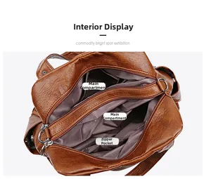 Layout interno della borsa in pelle marrone con doppio scomparto e cerniera centrale
