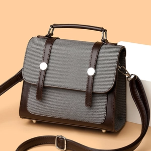 Borsa a mano vintage bicolore in pelle marrone e tessuto grigio con tracolla e fibbie