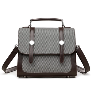 Borsa vintage in tela stile college con finiture in pelle marrone e fibbie metalliche