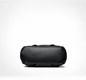 Detail view of the black lychee pattern leather bag base with embossed brand logo
