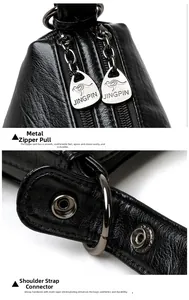 Macro detail of gunmetal zipper with kangaroo logo and textured lychee pattern leather