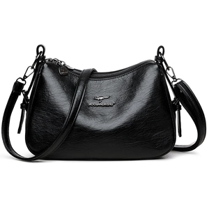 Classic black soft leather handbag with adjustable strap for women in minimalist style