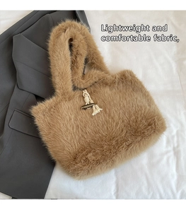 Detail of light brown faux fur tote bag showing the wooden horn button and plush texture