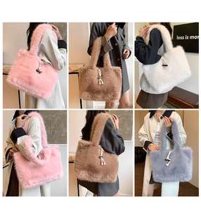 Detail showing plush tote bags in pink, brown, white, and grey with wooden toggle buttons