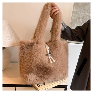 Close-up of fluffy faux fur tote bag with braided cord knot and metallic buckle detail