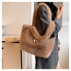 Brown faux fur tote bag showing soft plush texture and long shoulder strap detail