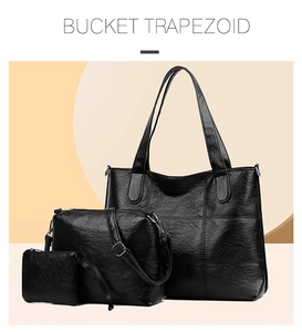 Detailed view of 3-piece black tote set including crossbody bag and small pouch