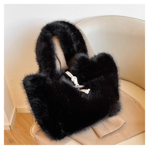 Close-up of black faux fur tote bag featuring a classic wooden toggle horn button closure