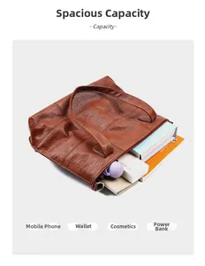 Detail view of large capacity brown tote bag showing storage for books and accessories