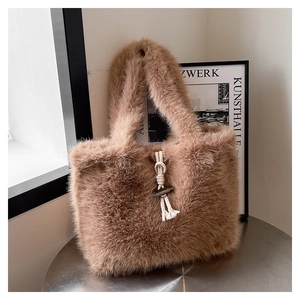Close-up of fluffy faux fur tote bag featuring a vintage wooden toggle button closure
