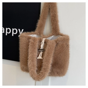Close-up of brown faux fur tote bag showing horn buckle and woven rope detail
