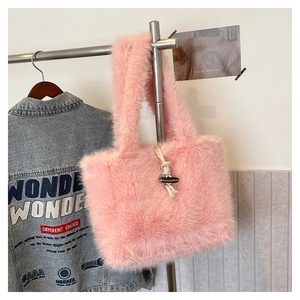 Detailed close-up of pink faux fur tote bag featuring retro cream rope and horn button closure