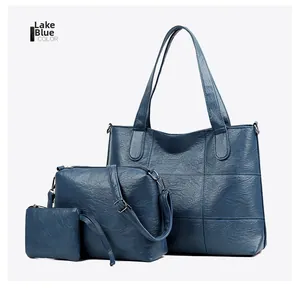 Three-piece lake blue tote bag set including crossbody and small clutch in soft PU leather