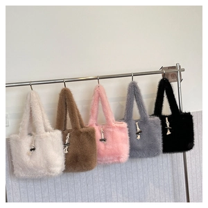 Row of plush faux fur tote bags in five colors with horn button buckle details