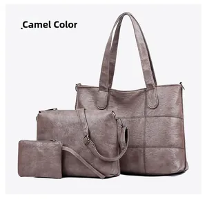 Detailed view of camel faux leather 3-piece bag set with tote, crossbody, and purse