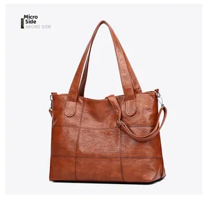 Micro side view of vintage brown quilted tote bag with soft leather texture and wide handle