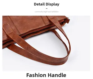 Detailed view of dark brown tote bag leather texture, sturdy handles, and zipper closure