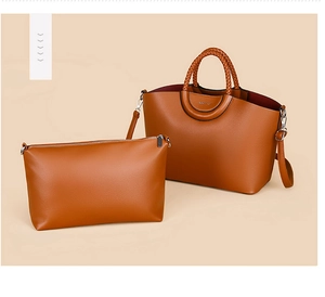 Close-up of brown faux leather tote with woven handles and matching inner pouch set