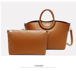 Brown litchi grain tote bag and matching pouch set with woven handles and logo detail