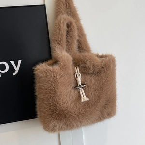 Brown faux fur tote bag with plush texture and decorative horn buckle closure