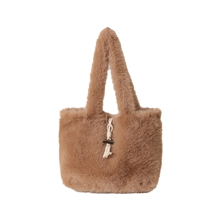 Brown faux fur tote bag with toggle closure and plush texture on white background
